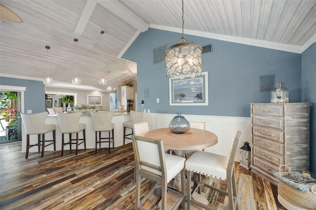 6605 Seabird Way, Apollo Beach, FL 33572 - dining space featuring dark wood finished floors, wainscoting, high vaulted ceiling, beamed ceiling, and a decorative wall