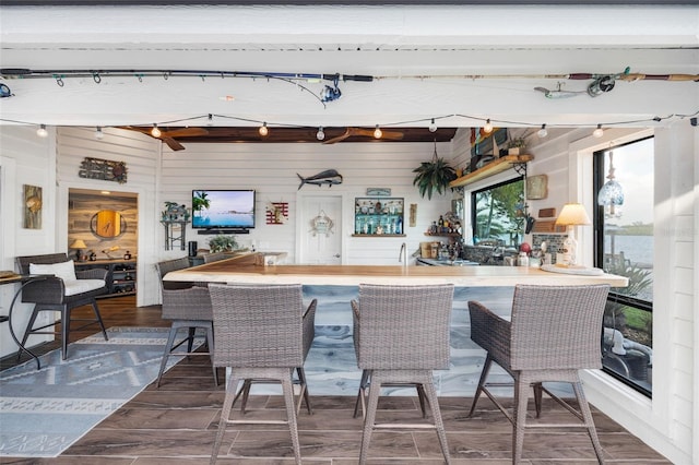 6605 Seabird Way, Apollo Beach, FL 33572 - indoor wet bar featuring wooden walls and wood finished floors