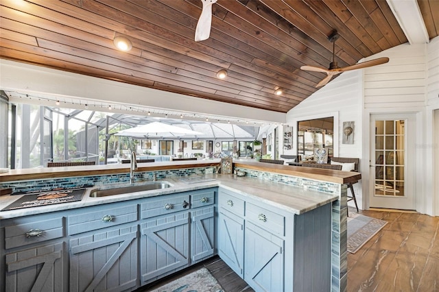 6605 Seabird Way, Apollo Beach, FL 33572 - kitchen with wooden ceiling, a ceiling fan, lofted ceiling, dark wood-style flooring, and a sunroom