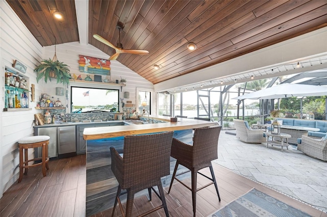 6605 Seabird Way, Apollo Beach, FL 33572 - indoor bar with lofted ceiling, wood ceiling, a sunroom, a ceiling fan, and wood finished floors