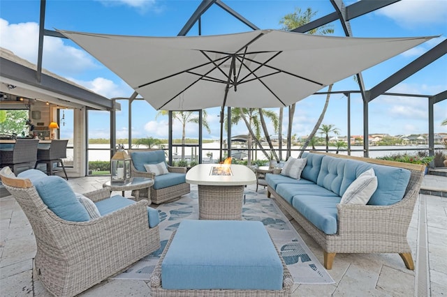 6605 Seabird Way, Apollo Beach, FL 33572 - view of patio / terrace with an outdoor living space with a fire pit and a lanai