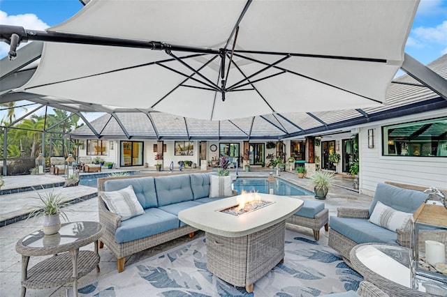 6605 Seabird Way, Apollo Beach, FL 33572 - view of patio with an outdoor living space with a fire pit, an outdoor pool, and a lanai