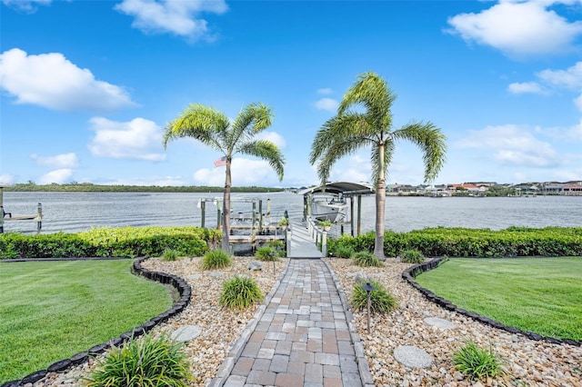 6605 Seabird Way, Apollo Beach, FL 33572 - dock area with boat lift, a yard, and a water view