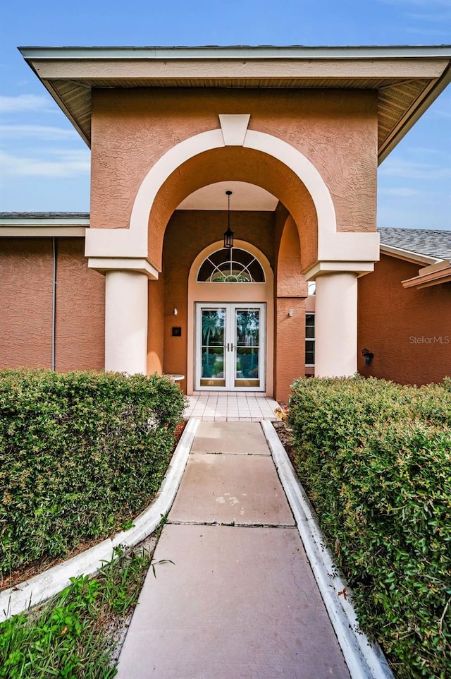 3612 Covington Dr, Holiday, FL 34691 - property entrance with stucco siding and french doors