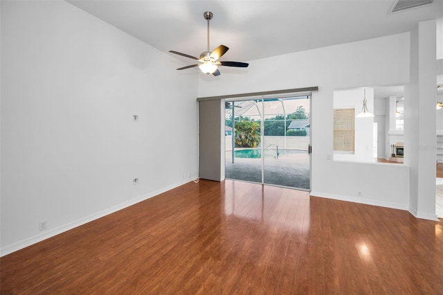 3612 Covington Dr, Holiday, FL 34691 - spare room featuring ceiling fan, wood finished floors, and lofted ceiling
