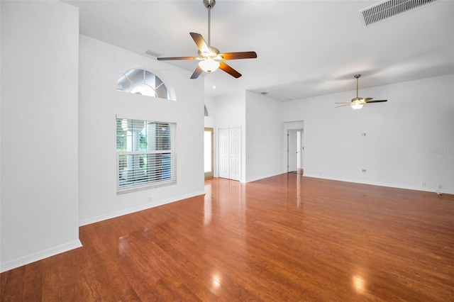 3612 Covington Dr, Holiday, FL 34691 - unfurnished living room featuring ceiling fan, wood finished floors, and lofted ceiling