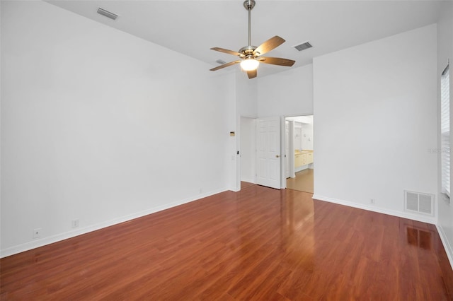3612 Covington Dr, Holiday, FL 34691 - spare room with ceiling fan, wood finished floors, and high vaulted ceiling