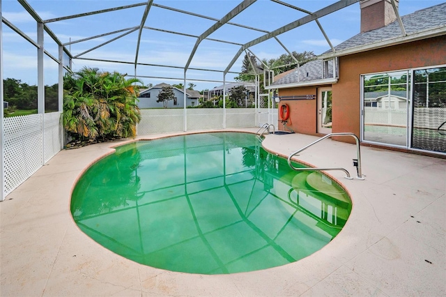 3612 Covington Dr, Holiday, FL 34691 - view of swimming pool with a patio area and glass enclosure