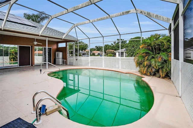 3612 Covington Dr, Holiday, FL 34691 - outdoor pool with ceiling fan, a patio area, and a lanai