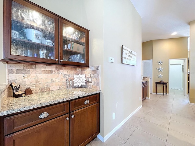 1358 Forestedge Blvd, Oldsmar, FL 34677 - bar area with decorative backsplash and light tile patterned floors