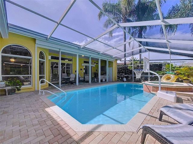 1358 Forestedge Blvd, Oldsmar, FL 34677 - view of swimming pool with a patio area, glass enclosure, a pool with connected hot tub, and a ceiling fan