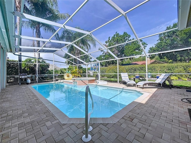 1358 Forestedge Blvd, Oldsmar, FL 34677 - view of swimming pool with a patio, a pool with connected hot tub, area for grilling, and a lanai