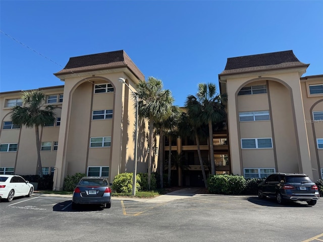 2525 W Bay Dr Unit A33, Largo, FL 33770 - view of building exterior featuring uncovered parking