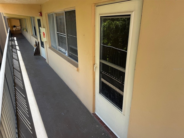 2525 W Bay Dr Unit A33, Largo, FL 33770 - view of exterior entry with stucco siding