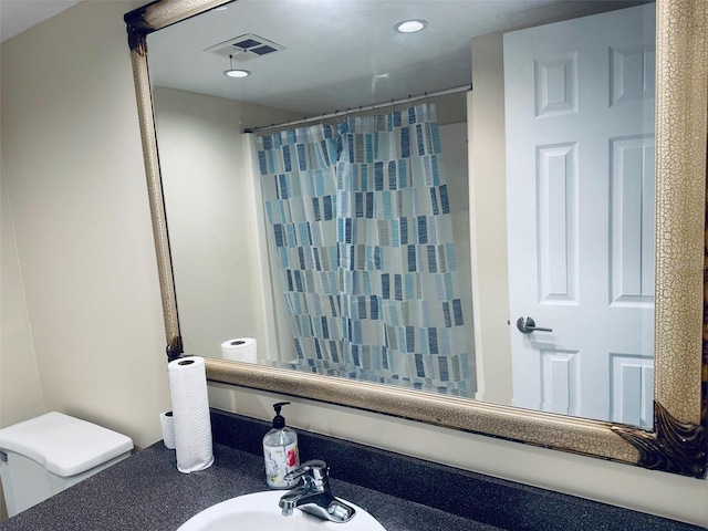 2525 W Bay Dr Unit A33, Largo, FL 33770 - full bathroom with recessed lighting, a shower with curtain, and vanity