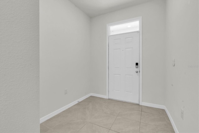 33036 Frosted Clover Way, Wesley Chapel, FL 33545 - foyer with light tile patterned floors and baseboards