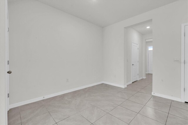 33036 Frosted Clover Way, Wesley Chapel, FL 33545 - spare room featuring light tile patterned floors and recessed lighting