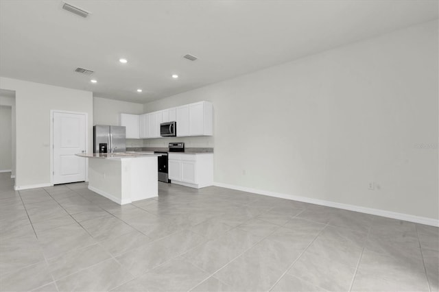 33036 Frosted Clover Way, Wesley Chapel, FL 33545 - kitchen with appliances with stainless steel finishes, recessed lighting, open floor plan, a kitchen island, and white cabinets