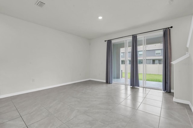33036 Frosted Clover Way, Wesley Chapel, FL 33545 - unfurnished room with light tile patterned floors and recessed lighting