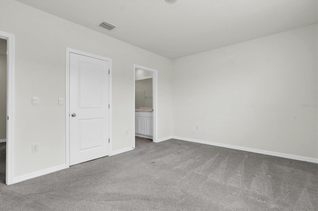 33036 Frosted Clover Way, Wesley Chapel, FL 33545 - unfurnished bedroom with carpet floors and ensuite bath