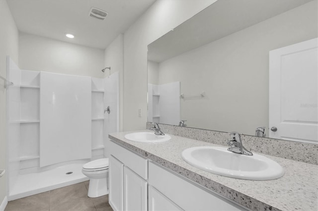 33036 Frosted Clover Way, Wesley Chapel, FL 33545 - bathroom with a stall shower, tile patterned floors, and double vanity
