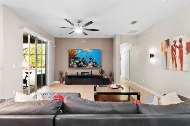 317 Royal Bonnet Dr, Apollo Beach, FL 33572 - living room featuring tile patterned floors, arched walkways, and a ceiling fan