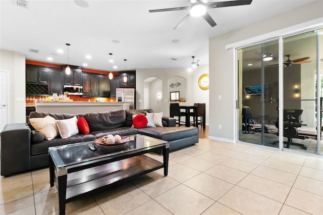 317 Royal Bonnet Dr, Apollo Beach, FL 33572 - living room featuring ceiling fan, arched walkways, light tile patterned floors, and recessed lighting