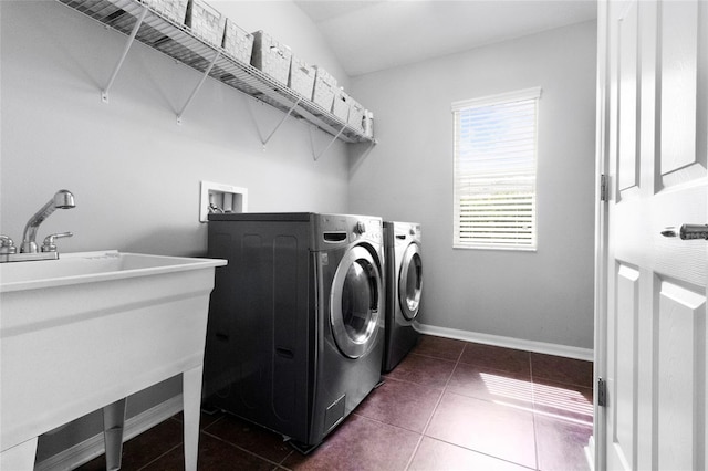 317 Royal Bonnet Dr, Apollo Beach, FL 33572 - washroom featuring washer and dryer and dark tile patterned floors