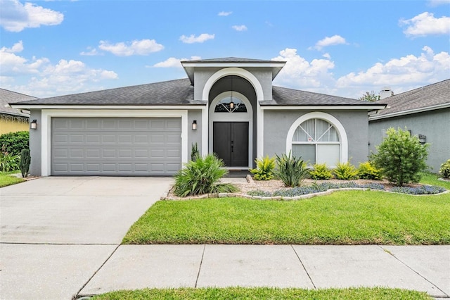 2208 Cattleman Dr, Brandon, FL 33511 - view of front facade with a front lawn, concrete driveway, stucco siding, an attached garage, and a shingled roof