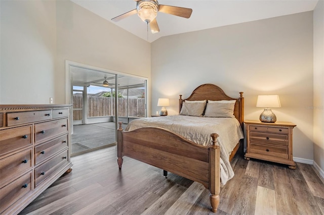 2208 Cattleman Dr, Brandon, FL 33511 - bedroom featuring access to exterior, wood finished floors, a ceiling fan, and vaulted ceiling