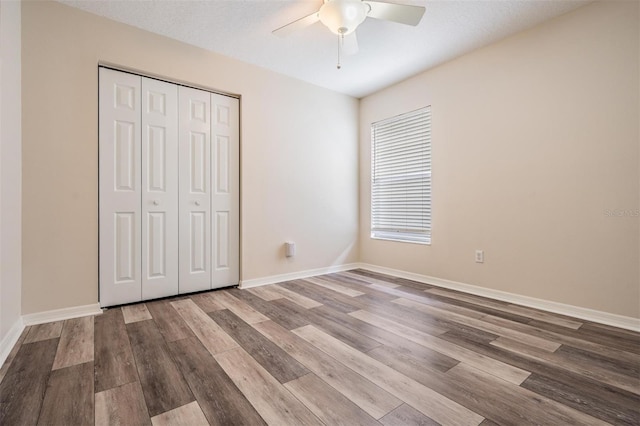 2208 Cattleman Dr, Brandon, FL 33511 - unfurnished bedroom with wood finished floors, a closet, and ceiling fan