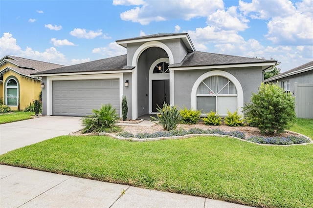 2208 Cattleman Dr, Brandon, FL 33511 - view of front of house featuring a front lawn, a garage, stucco siding, and driveway