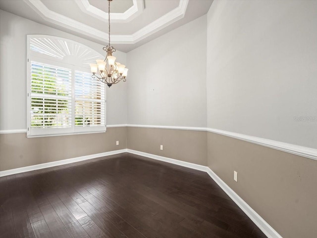 4521 Cheval Blvd, Lutz, FL 33558 - empty room with dark wood-style floors, a raised ceiling, a chandelier, and ornamental molding