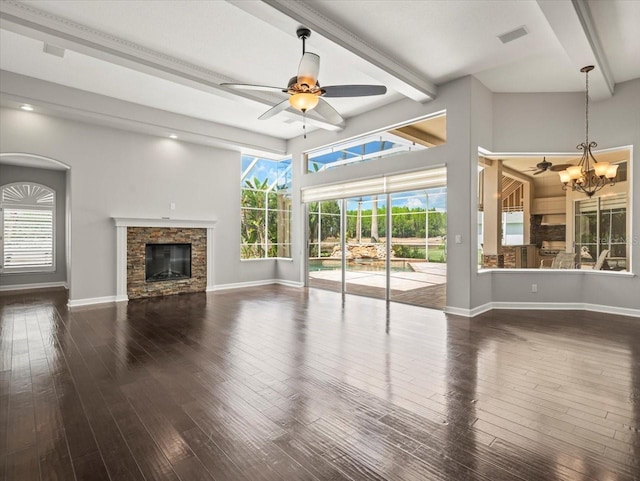 4521 Cheval Blvd, Lutz, FL 33558 - unfurnished living room with ceiling fan, beam ceiling, wood-type flooring, a fireplace, and a chandelier