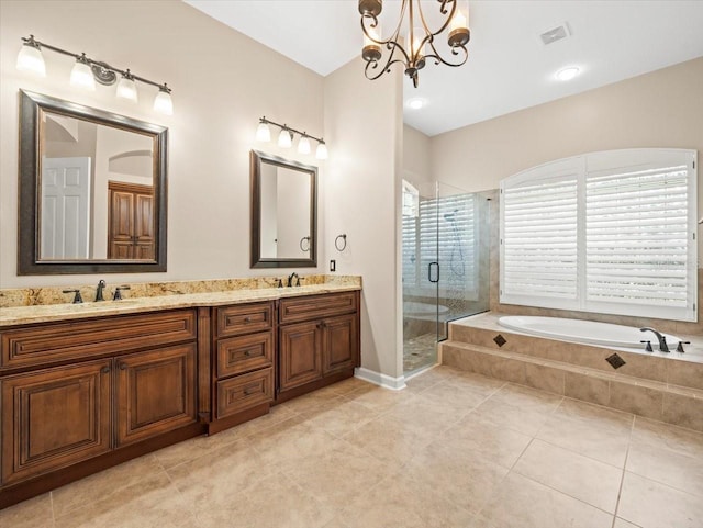 4521 Cheval Blvd, Lutz, FL 33558 - full bath featuring a stall shower, a bath, double vanity, a chandelier, and tile patterned floors
