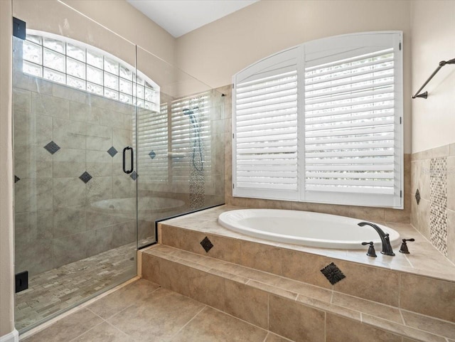 4521 Cheval Blvd, Lutz, FL 33558 - bathroom with a bath, a stall shower, and tile patterned floors