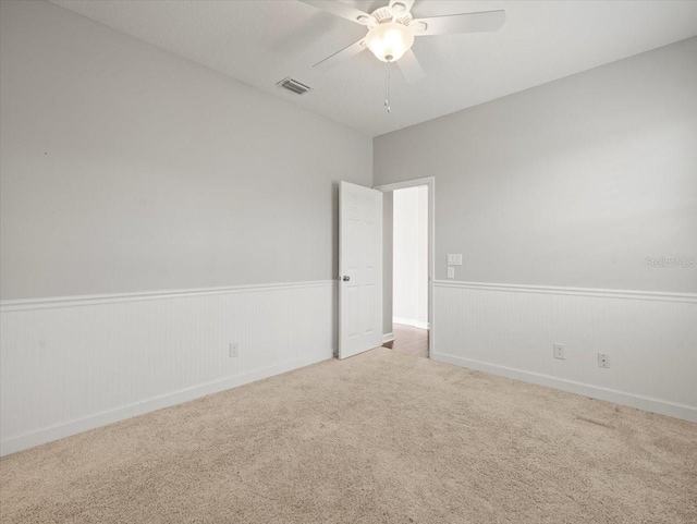 4521 Cheval Blvd, Lutz, FL 33558 - spare room featuring wainscoting, carpet flooring, and ceiling fan