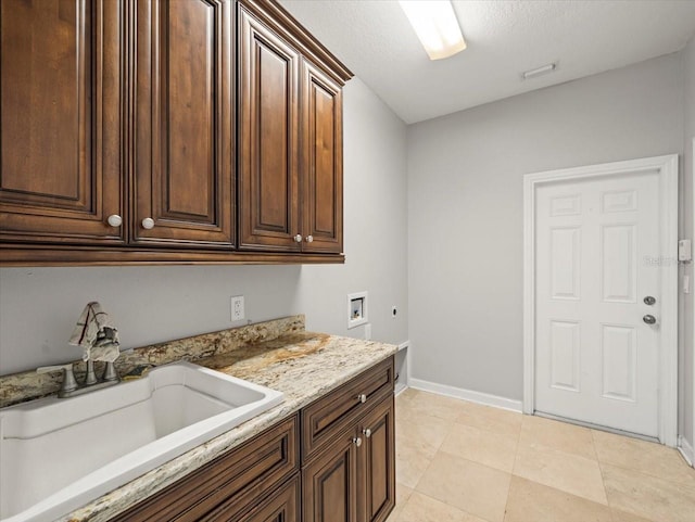 4521 Cheval Blvd, Lutz, FL 33558 - laundry area featuring cabinet space, electric dryer hookup, washer hookup, and a textured ceiling