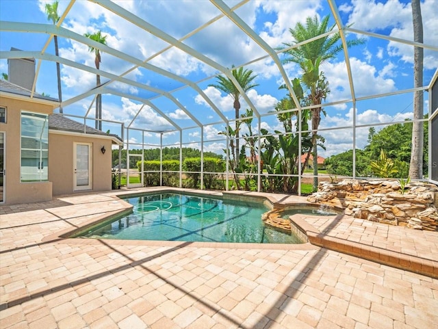 4521 Cheval Blvd, Lutz, FL 33558 - view of swimming pool with a patio area, glass enclosure, and a pool with connected hot tub