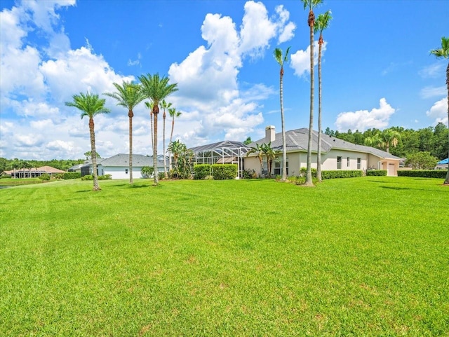 4521 Cheval Blvd, Lutz, FL 33558 - view of green lawn with glass enclosure