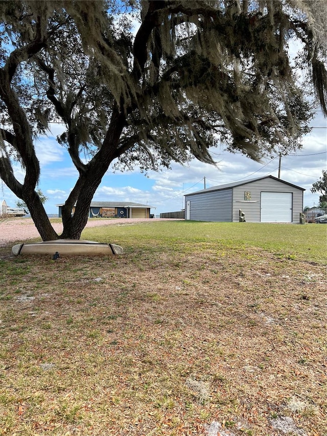 4119 Chambers St, Lake Wales, FL 33898 - view of green lawn with a garage and an outdoor structure