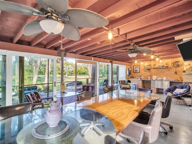 4915 S Rd, New Port Richey, FL 34652 - sunroom with beamed ceiling and concrete flooring
