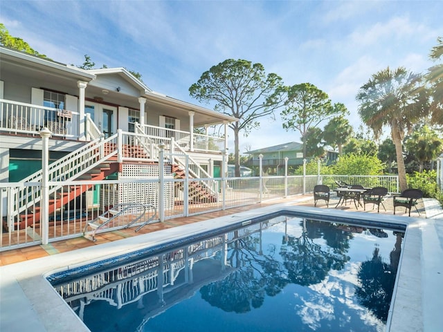 4915 S Rd, New Port Richey, FL 34652 - view of swimming pool with stairway, a fenced backyard, and a patio