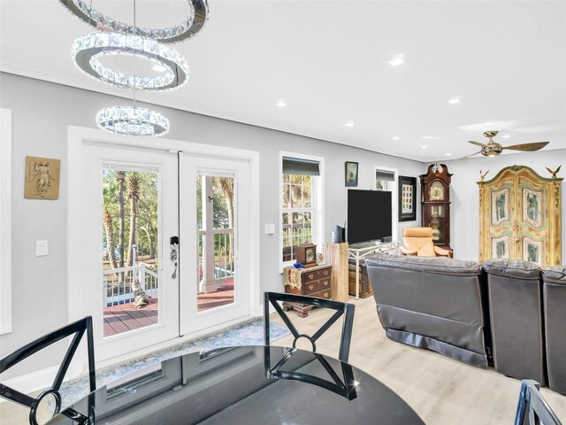 4915 S Rd, New Port Richey, FL 34652 - living area featuring french doors, light wood-type flooring, recessed lighting, a chandelier, and a ceiling fan
