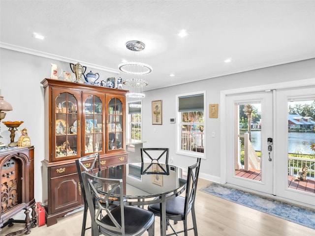 4915 S Rd, New Port Richey, FL 34652 - dining room with a chandelier, light wood-type flooring, ornamental molding, and recessed lighting