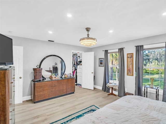 4915 S Rd, New Port Richey, FL 34652 - bedroom featuring light wood-style floors, recessed lighting, and a walk in closet