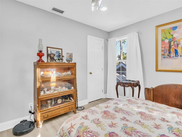 4915 S Rd, New Port Richey, FL 34652 - bedroom with wood finished floors and baseboards
