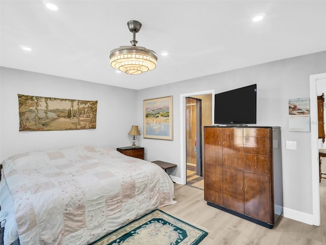 4915 S Rd, New Port Richey, FL 34652 - bedroom featuring light wood-style floors, recessed lighting, and connected bathroom