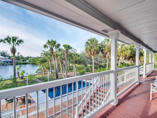 4915 S Rd, New Port Richey, FL 34652 - wooden terrace with a water view and view of wooded area
