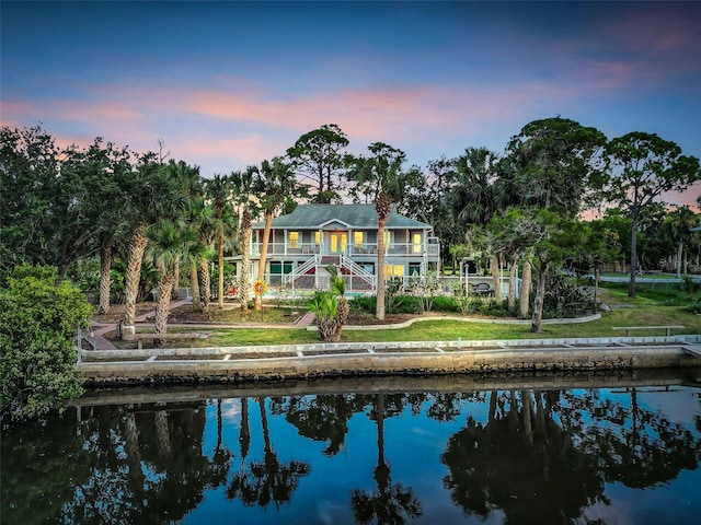 4915 S Rd, New Port Richey, FL 34652 - rear view of property with a water view, a balcony, and stairway